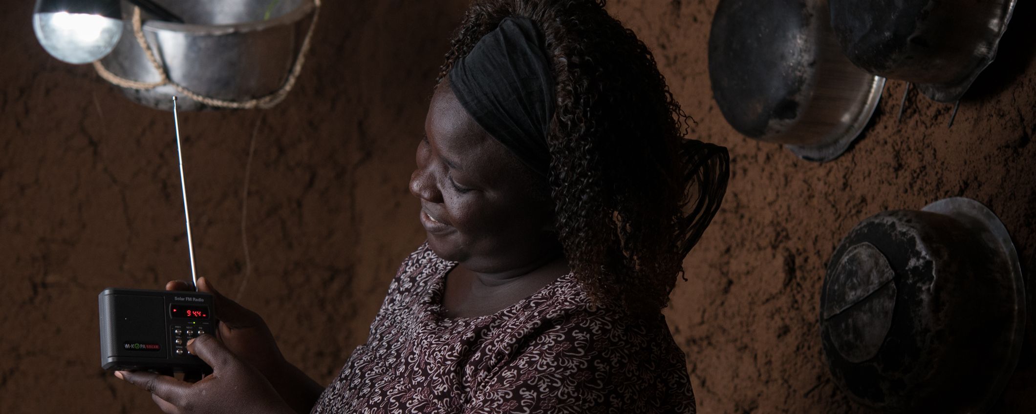 MKOPA woman in kitchen